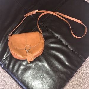 Brown purse with tassel crossbody, leather trim